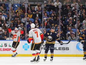 Nov 27, 2019; Buffalo, NY, USA; Calgary Flames center Elias Lindholm (28) scores the game winning goal in overtime to beat the Buffalo Sabres at KeyBank Center. Mandatory Credit: Timothy T. Ludwig-USA TODAY Sports ORG XMIT: USATSI-405370