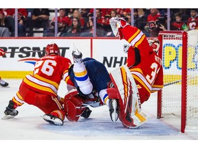 Nov 9, 2019; Calgary, Alberta, CAN; St. Louis Blues forward Brayden Schenn (10) and Calgary Flames goaltender David Rittich (33) collide during the second period at Scotiabank Saddledome. Mandatory Credit: Sergei Belski-USA TODAY Sports ORG XMIT: USATSI-405254