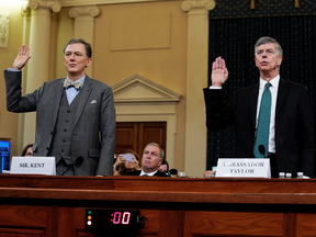 Ambassador Bill Taylor, charge d'affaires at the U.S. embassy in Ukraine; and George Kent, deputy assistant secretary of state for European and Eurasian Affairs, appear at the impeachment inquiry into President Donald Trump in Washington, Nov. 13, 2019.