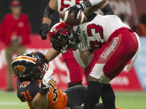 VANCOUVER. November 02 2019. BC Lions #31 Maleki Harris grabs at Calgary Stampeders #83 Josh Huff in a regular season CFL football game at BC Place, Vancouver, November 02 2019.   Gerry Kahrmann  /  PNG staff photo) 00059263A [PNG Merlin Archive]