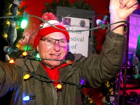 Otto Silzer, Lions Festival of Lights organizer, poses for a festive photo before the kickoff at Confederation Park. The 33rd annual light display will light up there park every night until Jan. 8. Photo by Brendan Miller/Postmedia.