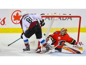 Colorado Avalanche Vladislav Kamenev scores on goalie David Rittich of the Calgary Flames during NHL hockey in Calgary on Tuesday. Photo by Al Charest/Postmedia.