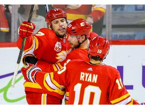 Calgary Flames Sam Bennett celebrates with teammates Milan Lucic and Derek Ryan after his goal against the Detroit Red Wings during NHL hockey in Calgary earlier this season. File photo by Al Charest/Postmedia.