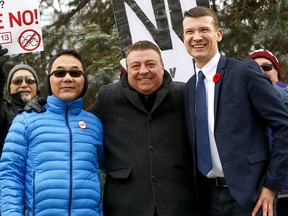 Calgary councillors L-R, Sean Chu, Joe Magliocca and Jeromy Farkas. They were at a rally against Calgary hosting the 2026 Winter Olympics at Olympic Plaza in Calgary on Saturday November 10, 2018. Darren Makowichuk/Postmedia