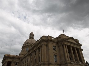 A heavy cloud cover is seen over the Alberta Legislature in Edmonton, Alta., on Wednesday, June 18, 2014. Ian Kucerak/Edmonton Sun/QMI Agency