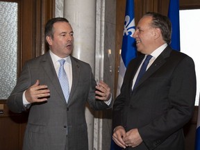 Premier Jason Kenney chats with Quebec Premier Francois Legault on June 12, 2019, at the Legault's office in Quebec City.