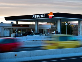 Traffic passes a Repsol SA gas station on a highway in Puigdalbert, near Barcelona, Spain, on Wednesday, Jan. 23, 2013. Repsol SA is Spain's largest energy company.