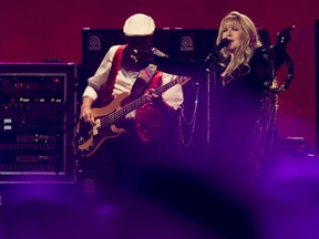 John McVie and Stevie Nicks perform with Fleetwood Mac at Rexall Place, in Edmonton Alta., on Saturday Nov. 15, 2014. David Bloom/Edmonton Sun/QMI Agency