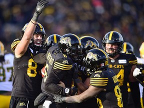 Hamilton Tiger-Cats quarterback David Watford (6) celebrates his touchdown with teammates during the CFL’s East final against the Edmonton Eskimos in Hamilton on Sunday, Nov. 17, 2019. (THE CANADIAN PRESS/Frank Gunn)