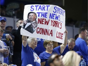 Fans with NY sign  as the Blue Jays beat the New York Yankees 9-0 in Toronto on Friday September 23, 2016. Michael Peake/Toronto Sun/Postmedia Network