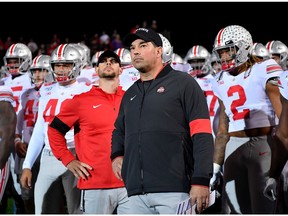 Head coach Ryan Day of the Ohio State Buckeyes and his players prepare to take the field before the game against the Northwestern Wildcats at Ryan Field on Oct. 18 in Evanston, Ill.