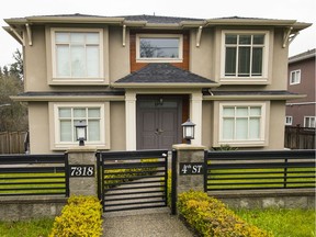 The B.C. Civil Forfeiture Office is suing to seize this Burnaby house at 7318 Fourth St. as proceeds of crime. It's linked to an alleged Canada Revenue Agency scam.