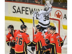 The Calgary Flames celebrate a goal against the Los Angeles Kings during the second period at Scotiabank Saddledome on Saturday night. Photo by Azin Ghaffari/Postmedia.