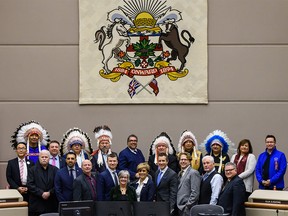 From Left; Councillor Stanley Big Plume, Tsuu T'ina Nation, Chief Aaron Young, Chiniki First Nation, Chief Stanley Grier, Piikani Nation, Mayor Naheed Nenshi, Chief Clifford Poucette, Wesley First Nation, Chief Darcy Dixon, Bearspaw First Nation, Moez Maherali, Treaty 7 First Nations Chiefs' Association, Anne Many Heads, CEO of Treaty 7 First Nations Chiefs' Association, Lawrence Gervais, President of Métis Nation of Alberta Region 3 and Calgary councillors pose for a photo on Monday, December 16, 2019 as Indigenous flags are raised in Calgary Council Chamber. Azin Ghaffari/Postmedia