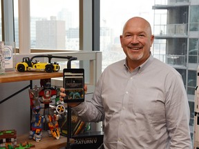 Terry Sydoryk, CEO of Chaordix, with Lego products - his company's top client.