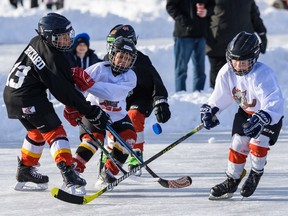 Bar Down play the Puck Hogs in Tyke A/B division (ages 4-6) at the Tim Hortons Western Canada Pond Hockey Championships in Chestermere on Friday, Dec. 27, 2019.