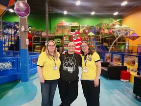 Site manager Kara Walker in centre flanked by supervisors Sherry Shwab (L) and Amy Jones (R), in front of colourful equipment at Big Box,  a monster indoor playground and family entertainment centre that is attracting a huge following of children and their parents, and has created another small business for Calgary investors. Supplied