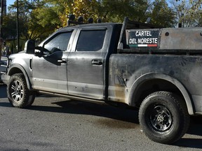 A pick up truck is pictured after clashes sparked by suspected cartel gunmen in a northern Mexican town killed 20 people this weekend in Villa Union, in Coahuila state, Mexico December 1, 2019.