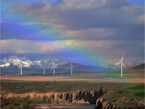 An early morning rainbow shines over wind turbines near Pincher Creek, Alberta on Thursday May 11, 2017.