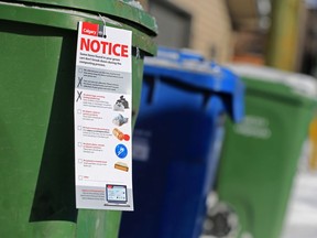 A green cart notice showing what cannot go into Calgary's composting bins was photographed on Wednesday February 13, 2019.