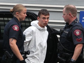 Brandon Newman, the suspect in the fatal stabbing of 47-year-old Deborah Onwu, is taken to the arrest processing unit on Friday, Oct. 25, 2019.