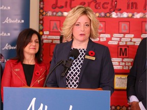 Marilyn Dennis, chair of the Calgary Board of Education, speaks to the media on Nov. 1, during an announcement by Minister of Education Adriana LaGrange, left.