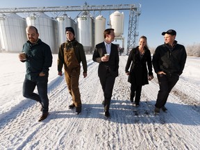 Agriculture and Forestry Minister Devin Dreeshen (centre) speaks with Mulligan Farm family members after a press conference on the Farm Freedom and Safety Act on the Mulligan Farm in Sturgeon County outside of Edmonton, on Wednesday, Nov. 20, 2019.