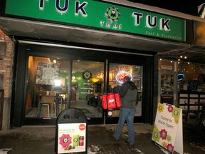 A SkipTheDishes delivery person is seen entering Tuk Tuk Thai restaurant on 17th Ave. SW. Between 20 to 30 percent at all Tuk Tuk Thai sales are through SkipTheDishes.