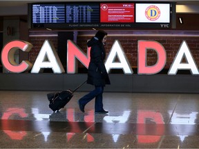 Travellers move through the Calgary International Airport on Monday December 16, 2019. Gavin Young/Postmedia