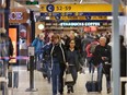 Travellers move through the Calgary International Airport on Monday.