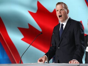 John Baird, Canadian foreign minister delivers a speech during the "Free Iran 2018 - the Alternative" event organized by exiled Iranian opposition group on June 30, 2018 in Villepinte, north of Paris. (Photo by Zakaria ABDELKAFI / AFP)