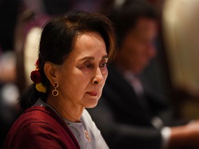 (FILES) In this file photograph taken on November 3, 2019, Myanmar's State Counsellor Aung San Suu Kyi looks on as she attends the 10th ASEAN-UN Summit in Bangkok, on the sidelines of the 35th Association of Southeast Asian Nations (ASEAN) Summit. - Former democracy icon Aung San Suu Kyi is set to make legal history when she defends Myanmar in The Hague on December 11, 2019, against charges of genocide targeting the Buddhist state's minority Rohingya Muslims. The tiny west African state of Gambia, acting on behalf of the 57-nation Organisation of Islamic Cooperation, will ask the International Court of Justice to take emergency measures to halt Myanmar's "ongoing genocidal actions". (Photo by Manan VATSYAYANA / AFP) (Photo by MANAN VATSYAYANA/AFP via Getty Images)