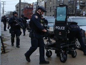 Police officers arrive to the scene where active shooting is happening in Jersey City on December 10, 2019. - One officer was shot when two gunmen with a long rifle opened fire in Jersey City, New Jersey, on the afternoon of December 10, 2019 , according to two officials. Two suspects were barricaded in a convenience store, the officials said. One officer was being taken to a nearby hospital.