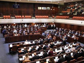 Lawmakers sit during a session of the Knesset (Israeli parliament) in Jerusalem on December 11, 2019. - Israel's parliament was rushing through a bill to call a third general election in a year, prolonging a political crisis and fuelling deep dissatisfaction with politicians. A deal to avert a new vote must be reached before 11:59 pm (2159 GMT), but unity government talks between rightwing premier Benjamin Netanyahu and his centrist rival Benny Gantz broke down. The Knesset passed in the morning a preliminary reading of a bill to dissolve itself, setting a new election for March 2. (Photo by Gali TIBBON / AFP) (Photo by GALI TIBBON/AFP via Getty Images)