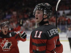 Canada's Alexis Lafreniere (11) celebrates after scoring his second goal of the game, and fifth Canadian goal, against the U.S. during the U20 Ice Hockey Worlds in Ostrava, Czech Republic, Thursday, Dec. 26, 2019.