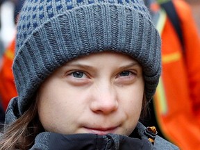 Climate change activist Greta Thunberg arrives to attend a Fridays for Future protest against government inaction on environment issues, in Turin, Italy December 13, 2019.