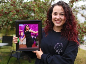 Racha El-Dib, holding a photo of her sister, Nadia, who was killed by an ex-boyfriend, has become an advocate in the fight against domestic abuse and speaks to high school students about healthy relationships.