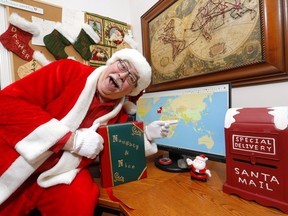 The EmailSanta, Alan Kerr operates a website that receives 1.2 million letters to Santa every year, and sends personalized responses via a special software program. He reaches kids in most countries in the world out of his home in Calgary on Sunday, December 22, 2019. Darren Makowichuk/Postmedia