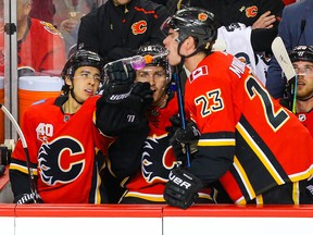 Calgary Flames Johnny Gaudreau celebrates with the purple Gatorade with teammates Sean Monahan and Matthew Tkachuk after his goal against the Buffalo Sabres during NHL hockey in Calgary on Thursday Dec. 5, 2019.
