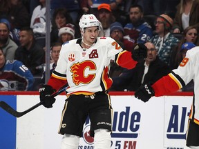 Sean Monahan celebrates his overtime goal as the Calgary Flames defeat the Colorado Avalanche on Monday, Dec. 9, 2019.