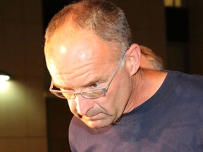Douglas Garland is arrested by Calgary police on Monday, July 14, 2014.