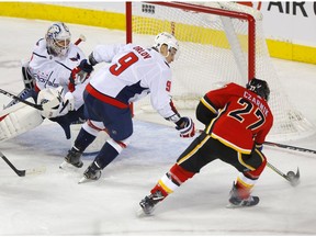 Calgary Flames forward Austin Czarnik scores on Washington Capitals goalie Braden Holtby at the Scotiabank Saddledome in this photo from Oct. 22. File photo by Darren Makowichuk/Postmedia.