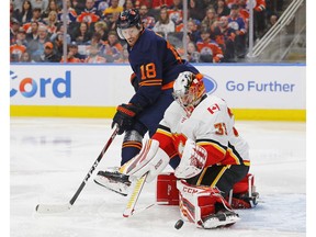 Calgary Flames goaltender David Rittich makes a save on Edmonton Oilers forward James Neal during the third period at Rogers Place on Friday night. Photo by Perry Nelson/USA TODAY Sports.