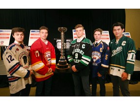 Calgary AAA players (L-R)  Heath Armstrong (Buffaloes), Kayden Smith (Flames), Sam Simard (Okotoks Oilers), Rhys Betham (Royals) and Clarke Huxley (Northstars) pose with the trophy at a press conference to kick off the Macs International Hockey Tournament in Calgary on Wednesday, December 11, 2019. Jim Wells/Postmedia