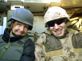 Calgary Herald journalist Michelle Lang with Chief of Defense Staff Walt Natynczyk in a military vehicle in Afghanistan on Dec. 25, 2009.