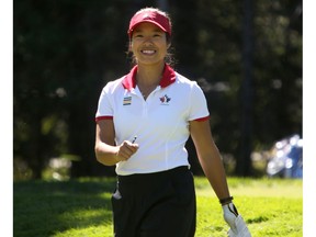 Calgarian Jaclyn Lee is all smiles after her shot from the first tee during round 2 of the Canadian Pacific Women's Open at Priddis Greens Golf and Country Club west of Calgary, Alta.,  August 26, 2016. Leah Hennel/Postmedia