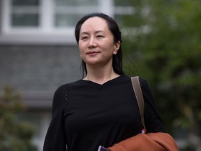 Huawei chief financial officer Meng Wanzhou leaves her home to attend a court hearing in Vancouver on Oct. 2, 2019.