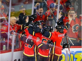Calgary Flames Milan Lucic celebrates with teammates after scoring a goal against the Buffalo Sabres during NHL hockey in Calgary on Thursday December 5, 2019. Al Charest / Postmedia