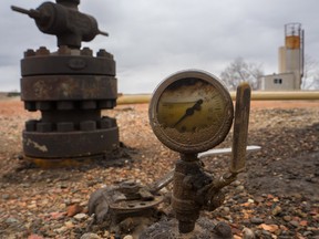 An oil gauge likely from the 1970s at an old well site.