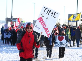 Protesters gather outside the Westin Airport Hotel in Calgary on Saturday, Nov. 30, 2019, where the UCP was holding its annual general meeting.